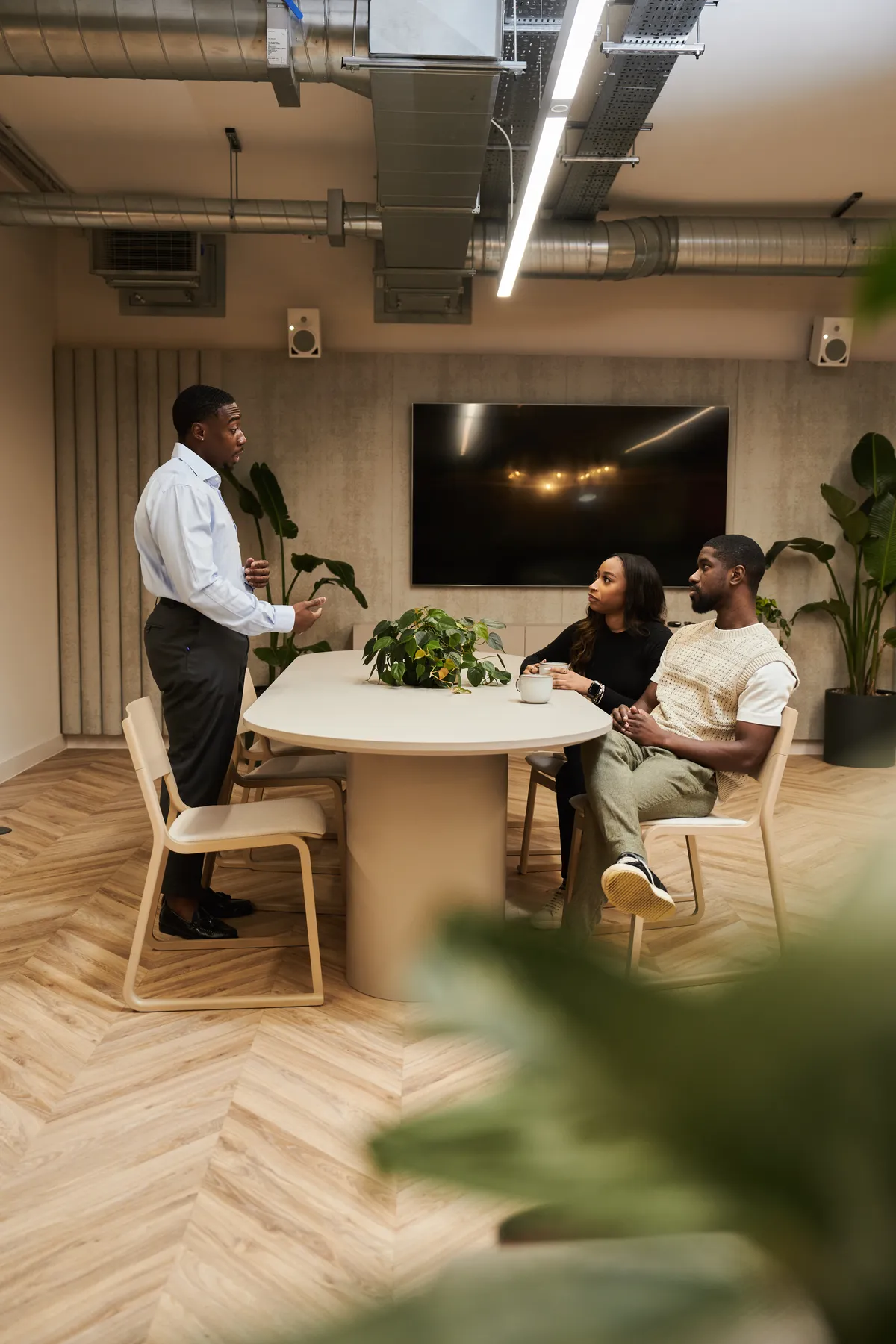 Accountant presenting to two clients
